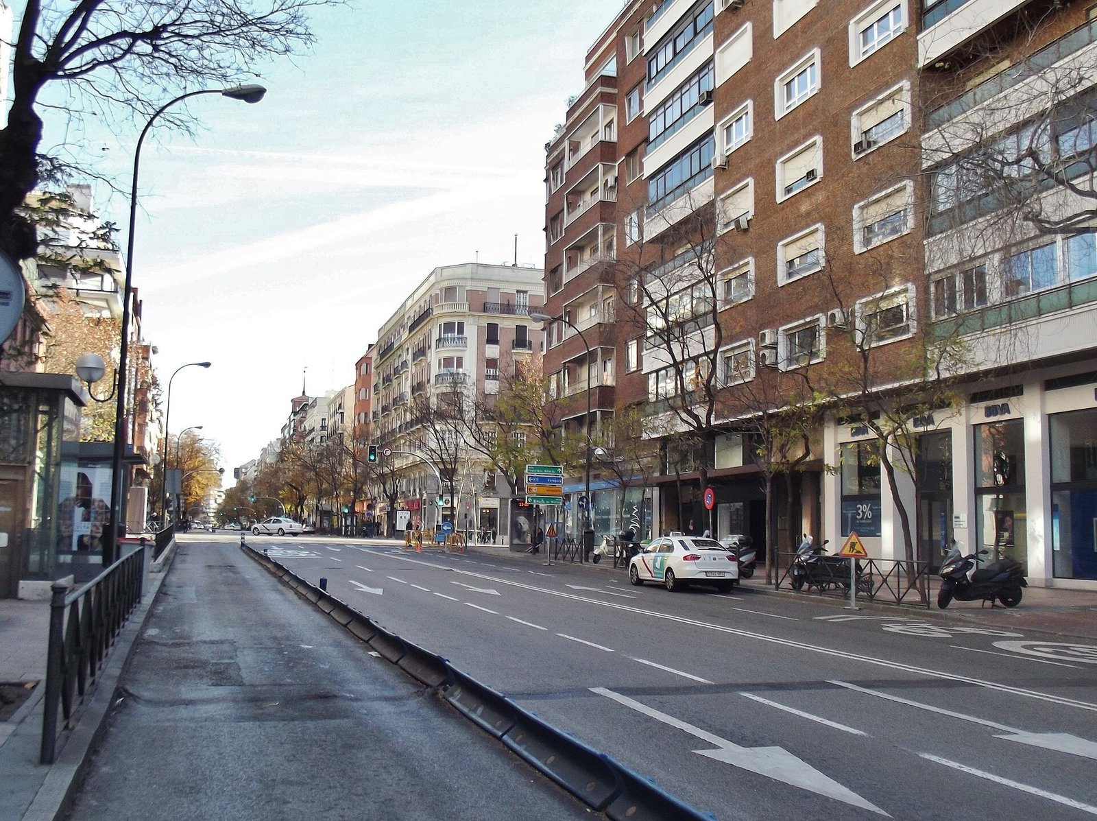 Calle de Diego de León in Madrid's Salamanca district, with apartment blocks along a wide road.