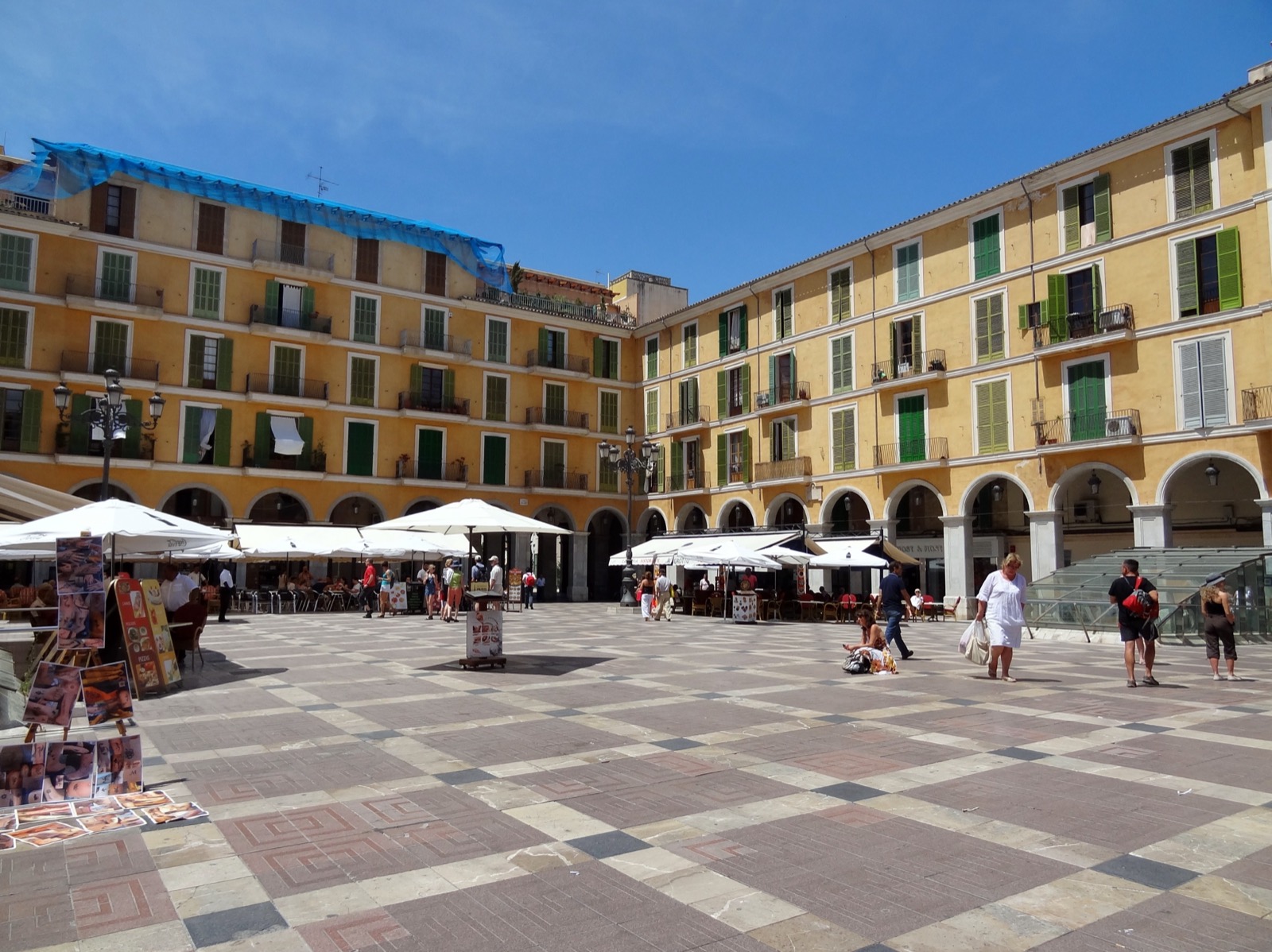 Restaurant terraces with umbrellas in Placa Major, Palma de Mallorca