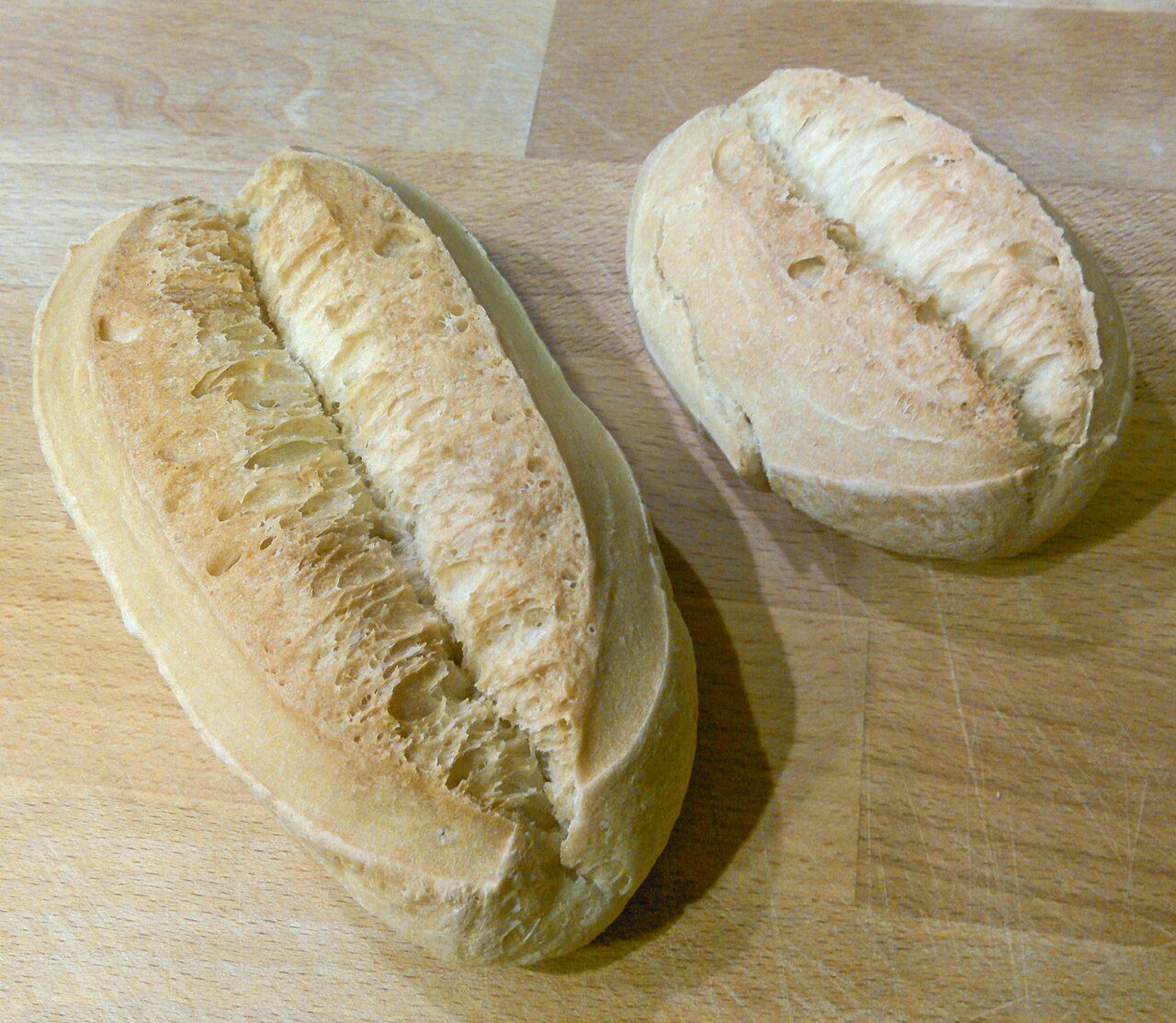 Two llonguets, the Mallorcan bread rolls Bar Vista Alegre is known for, on a wooden board (not a photo of the bar)