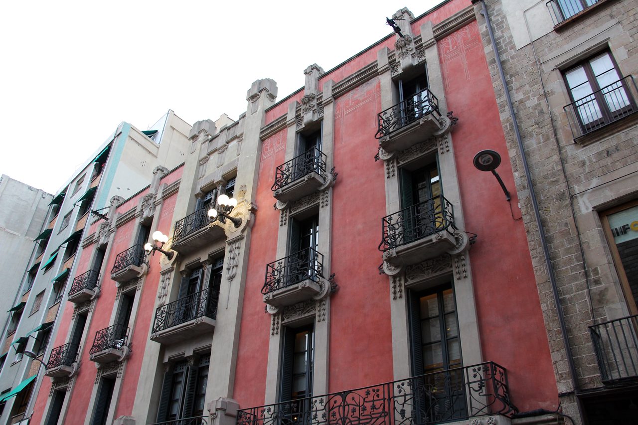 Balconied building facades on a street in Barcelona’s Gothic Quarter
