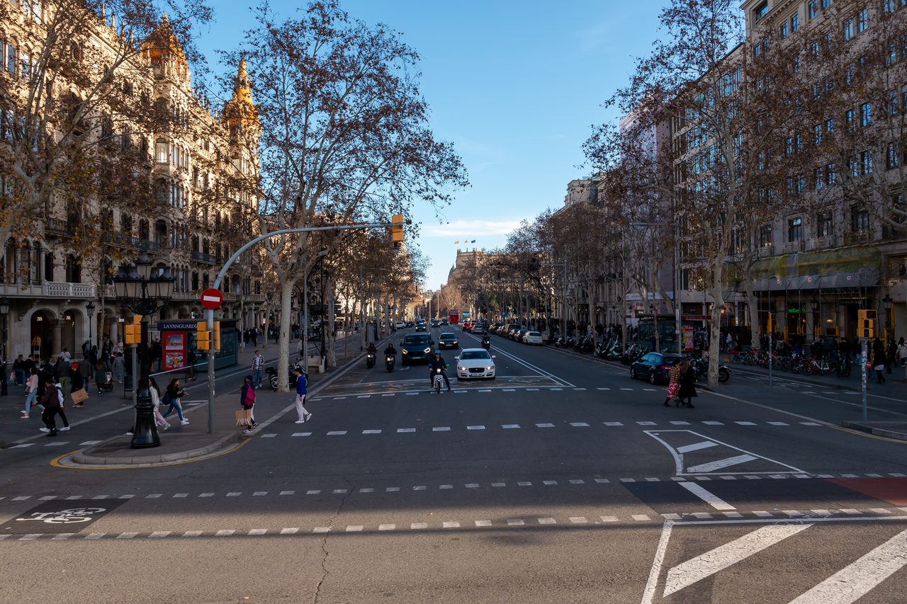 A wide street crossing in Barcelona’s Eixample