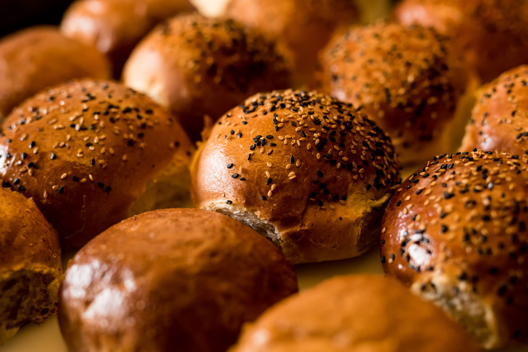 Freshly baked sesame brioche burger buns at Badal Corner