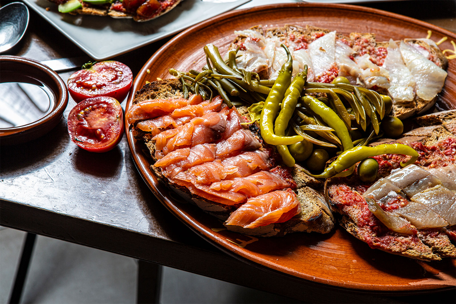 Pa amb oli plate with smoked salmon, anchovies and herring