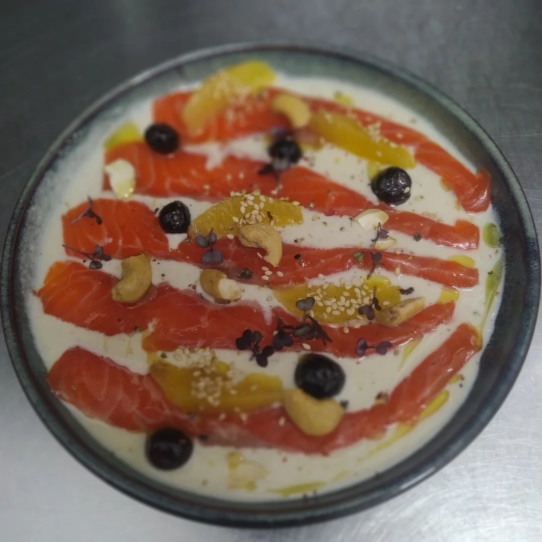 Cured salmon with cashews, olives, citrus and sesame on a creamy base at Bar Salvatge